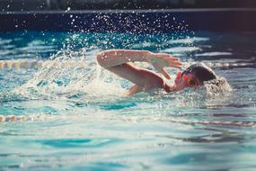 Child boy Swimming in pool