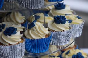 muffins with blue and white whipped cream