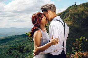 guy kisses a girl in the highlands