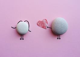 composition girl and boy made of stone heart