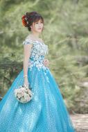 photo of asian bride in blue dress