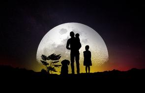 family silhouette of the moon background