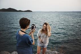 girlfriends at a photo session near the water