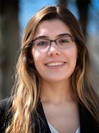 photo of a joyful student wearing glasses