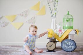 baby and cute scenery in a photo studio