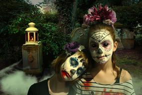 two child girls with sugar skull makeup