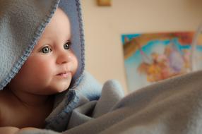 Baby head beneath tissue