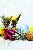 pineapples, party caps and balloons