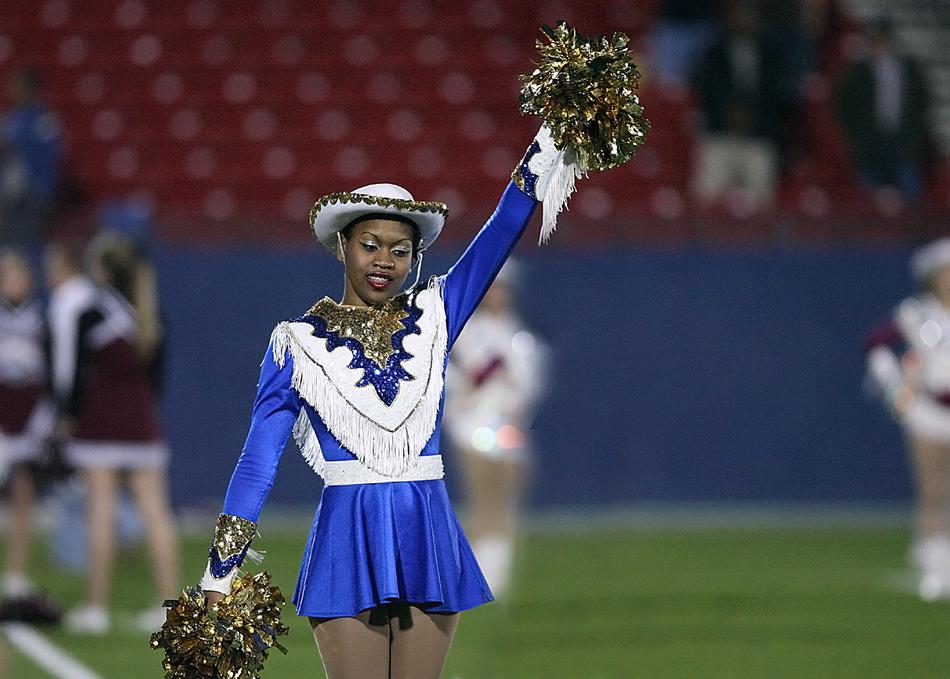 girl in a colorful uniform at the stadium