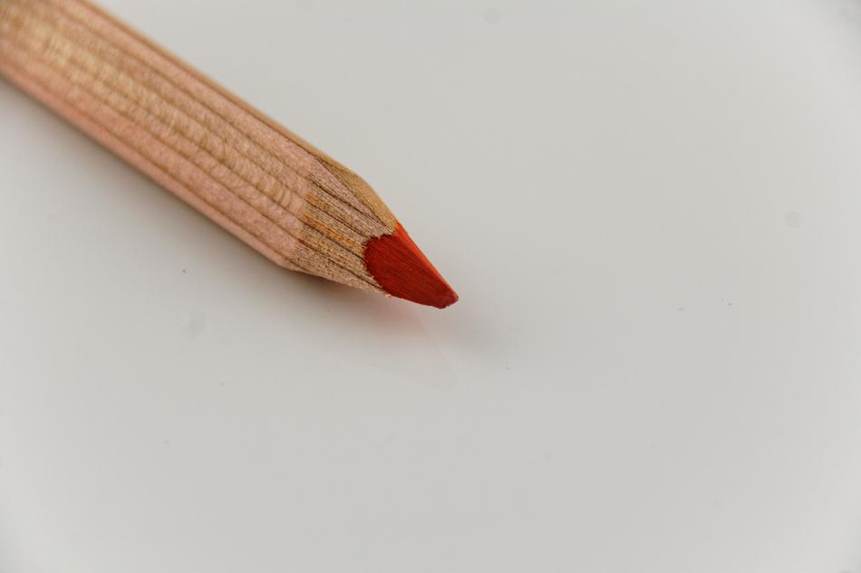 photo of a red pencil on a white background