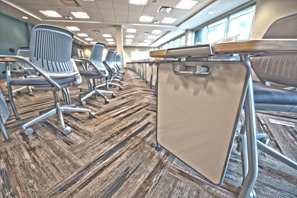 photo of a desk with chairs in the classroom