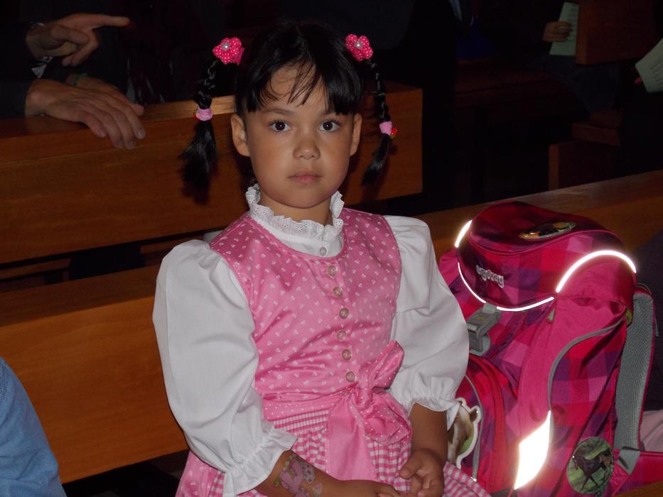Schoolgirl in pink and white dress