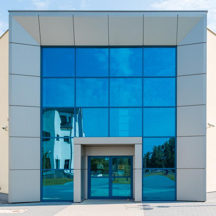 Glossy University in Kielce, Poland, with the reflections in the blue windows