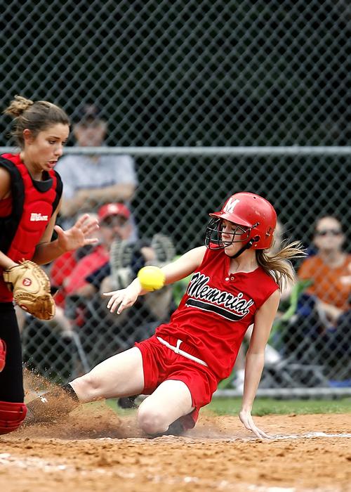 Girls, playing softball, on the sand, on the court with fence