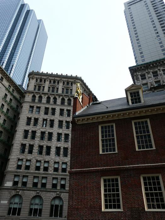 Colorful buildings in Boston, USA, at white sky on background