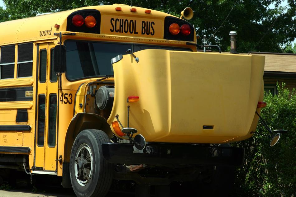 yellow school bus with open hood