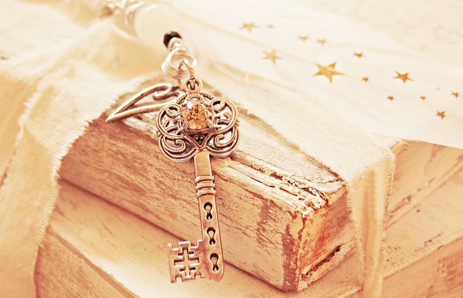 key with heart on the book