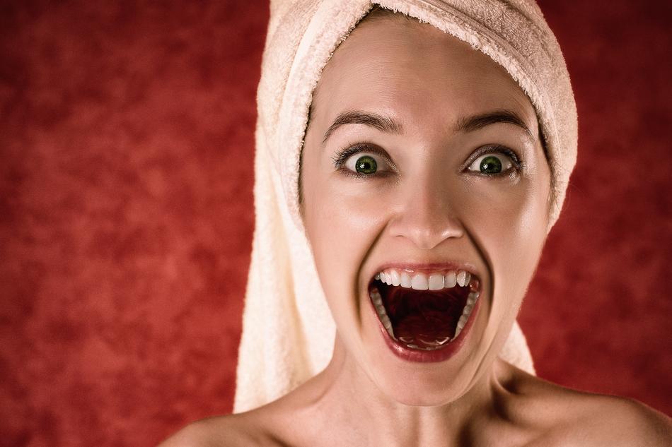 happy shouting woman with Towel around head, Portrait