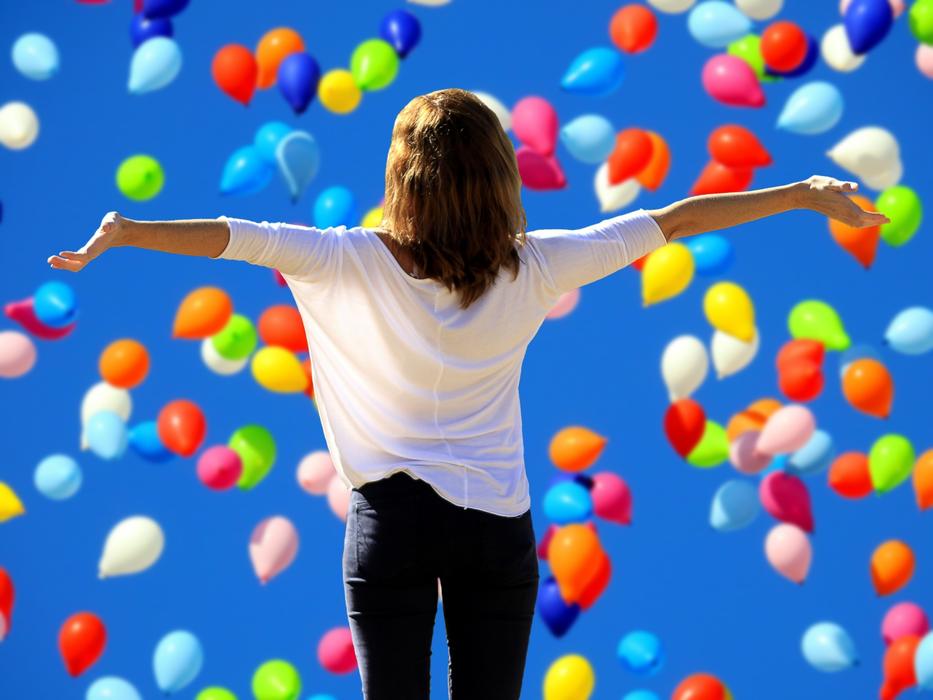 happy woman and air balloons