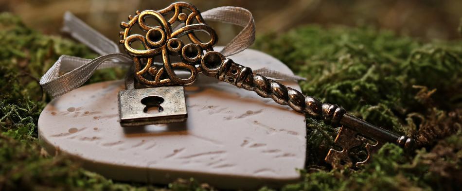 Beautiful and decorated key on the pink heart with text