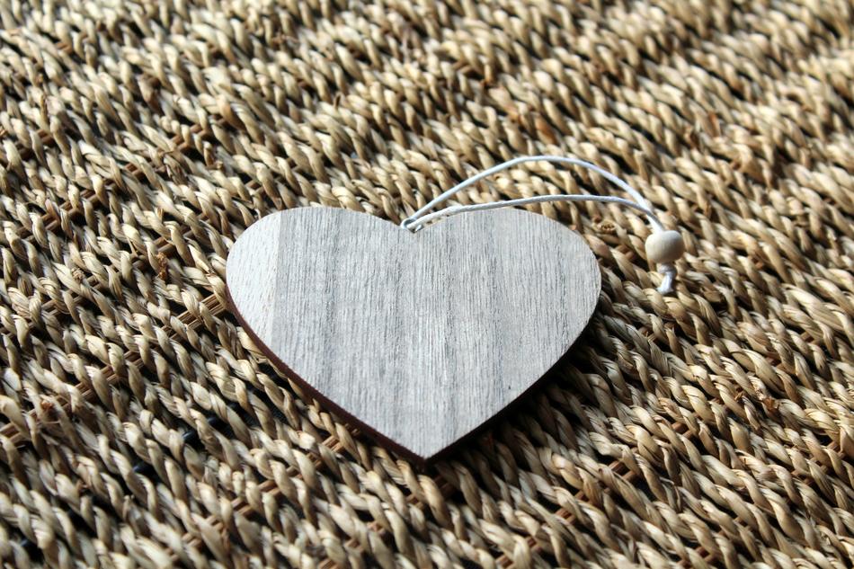 Beautiful, wooden heart on the wooden texture