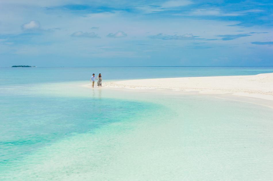 newlyweds on a tropical beach in the Maldives