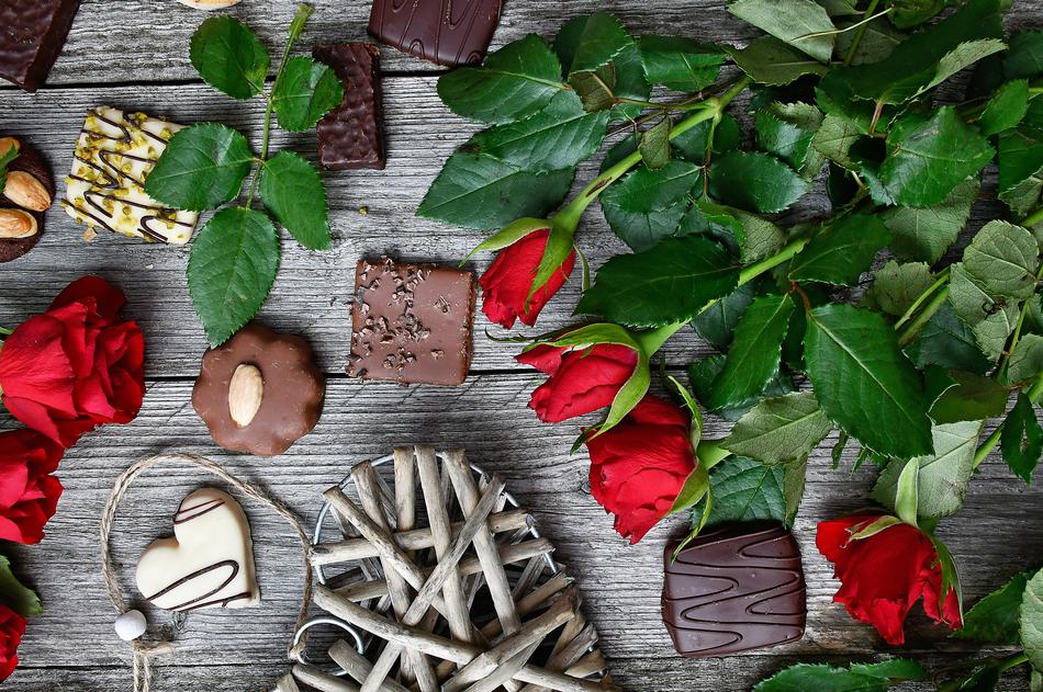 Roses and chocolates flat lay