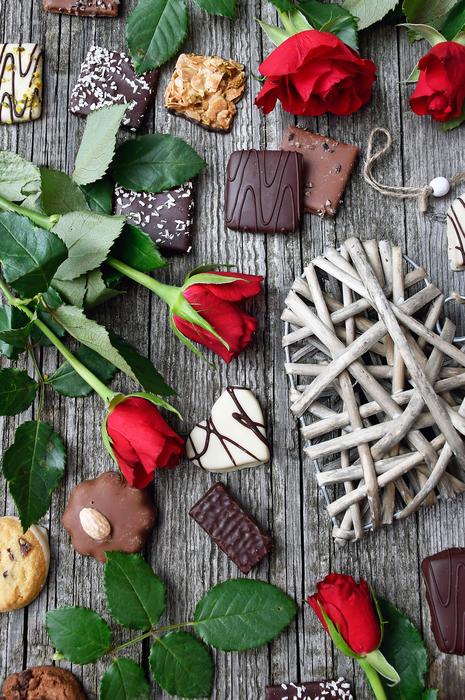 flat lay with flowers and chocolate