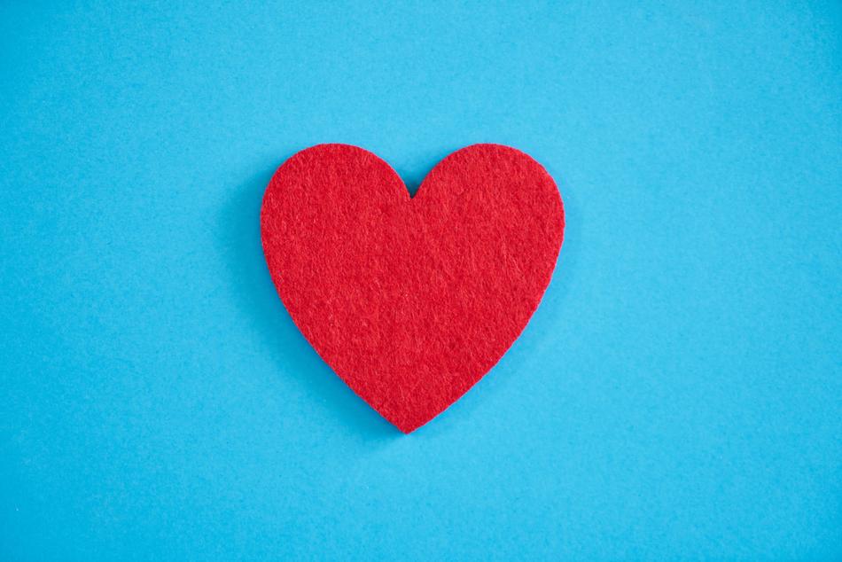 clipart of the red heart at the blue background