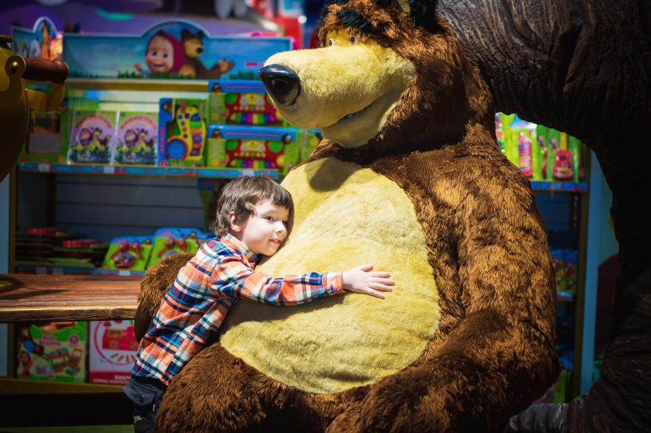 Child and bear toy