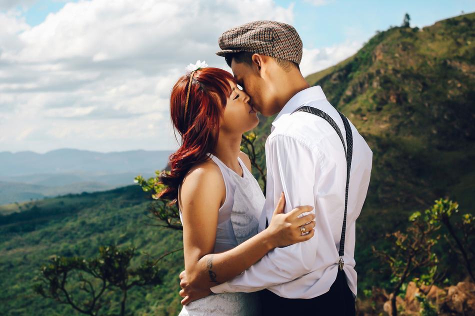 guy kisses a girl in the highlands