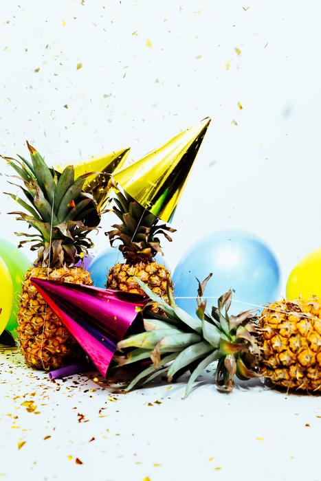 pineapples, party caps and balloons