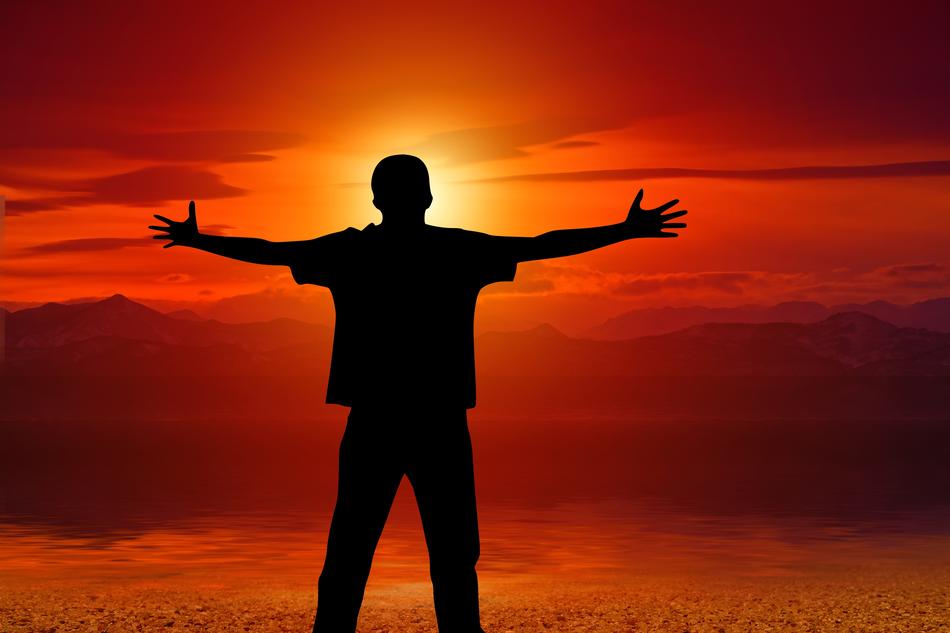 free man on a background of red sunset