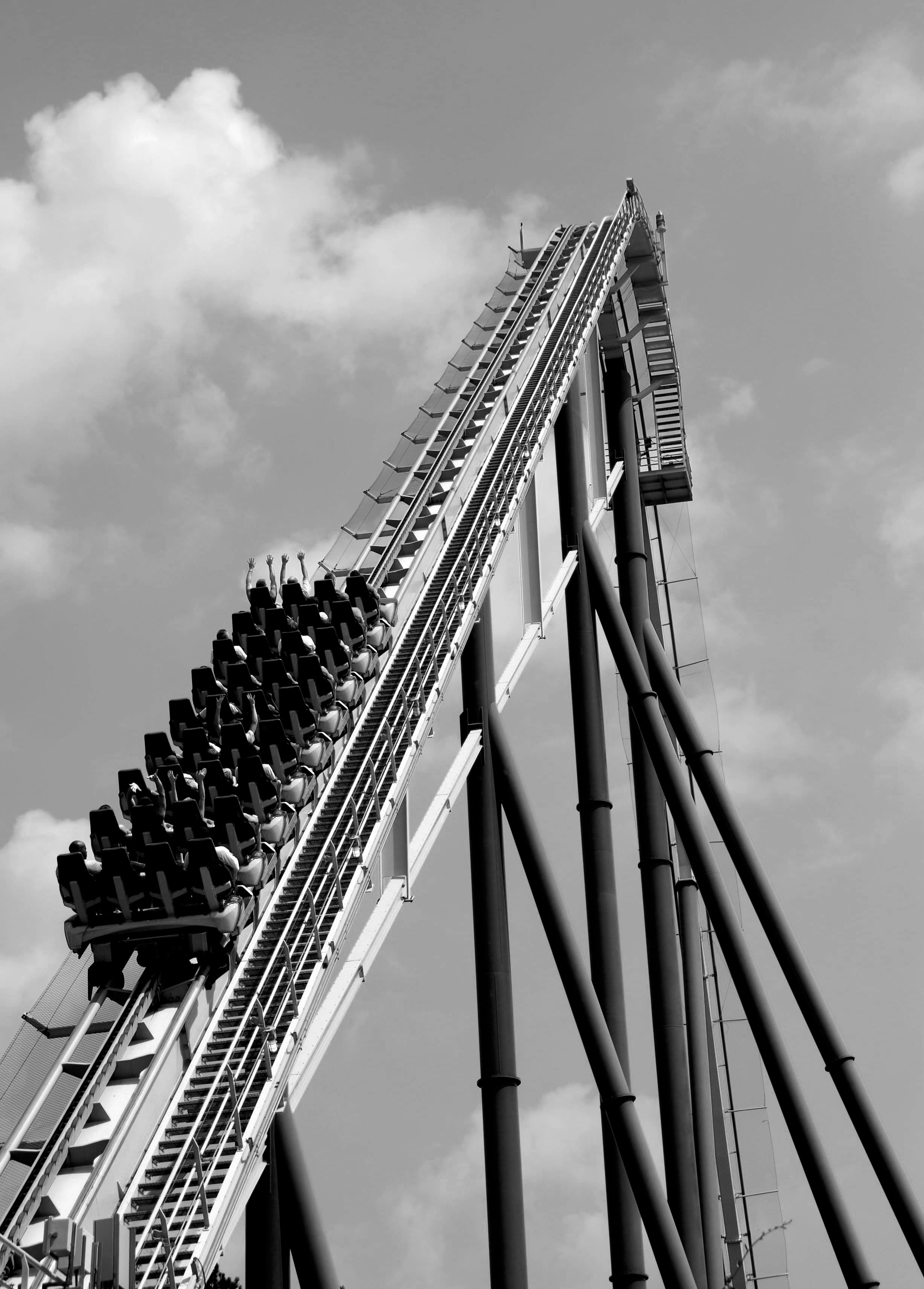 Black and white photo of the roller coast at the amusement park, under ...