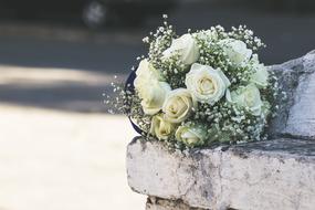 white wedding bouquet on stone steps