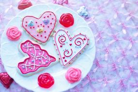 colorful heart-shaped cakes on a white plate