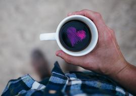purple heart in a cup of coffee