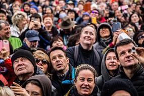 crowd of caucasian people looking up