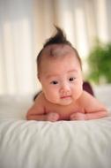 Cute baby lying on the bed