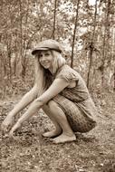 street style girl squatting in the forest