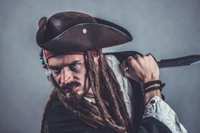 photo portrait of a young man in a pirate costume