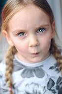 funny child Girl tightening lips