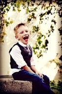 happy boy posing in the garden