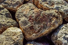 Beautiful rock, in form of heart, among the other rocks