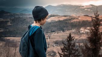 boy with a backpack on a hike