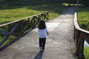 Girl walking on Bridge Road