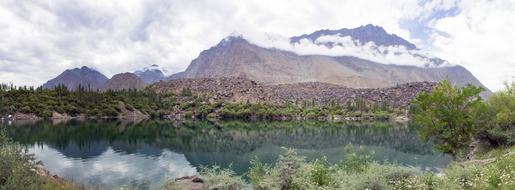 lake at the foot of a mountain in Pakistan