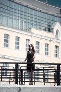 distant view of a girl on the embankment in Moscow