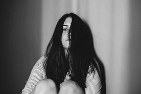 sad young Girl sitting, Black And White