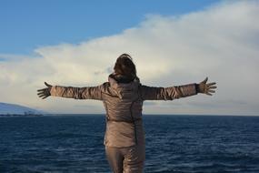 happy woman on the coast in Teriberka